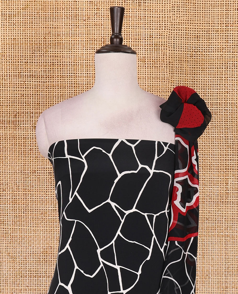 Black and white Italian crepe material churidar set, geometric printed top, plain bottom, and dupatta of floral and geometric print