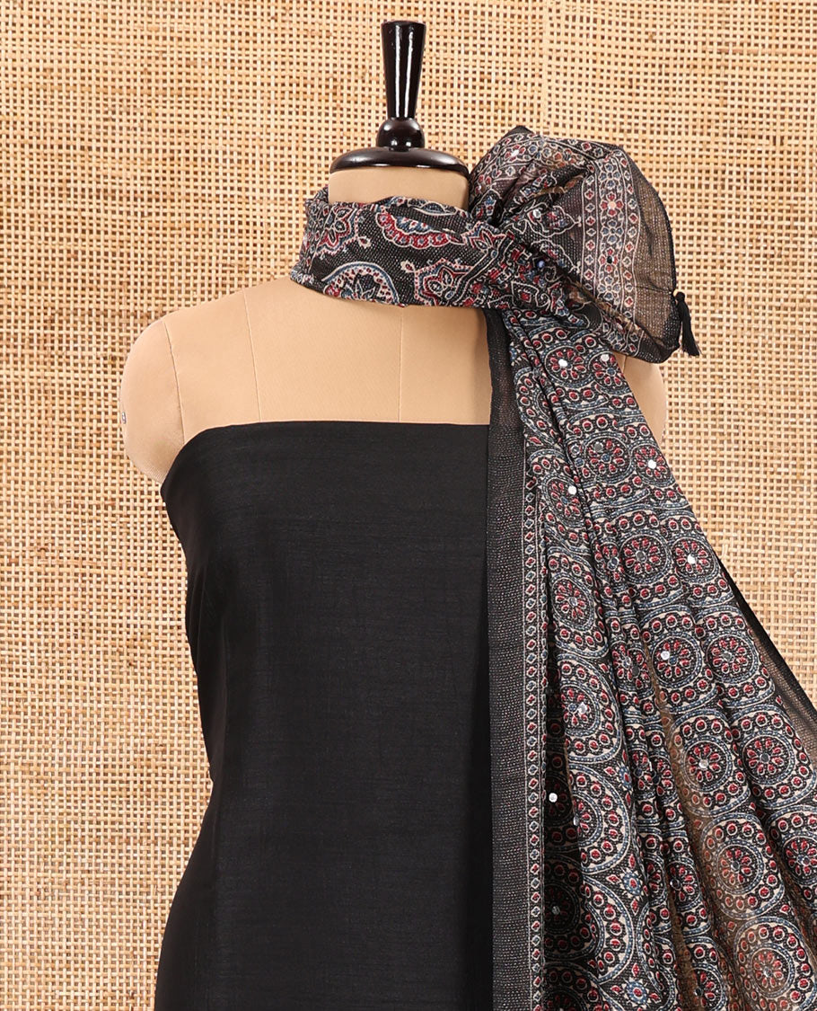Black material chudidar set, plain Vichitra silk top, santoon bottom, and dupatta of Ajrakh print and mirror work
