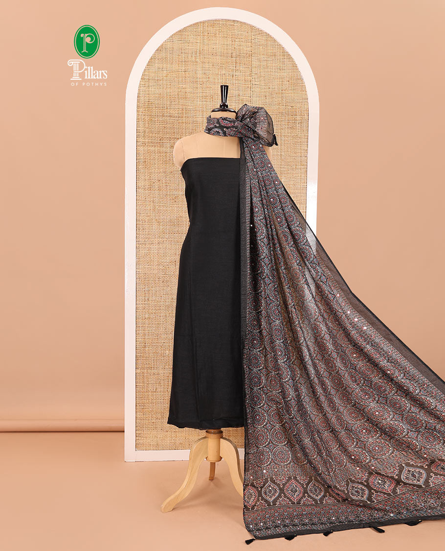 Black material chudidar set, plain Vichitra silk top, santoon bottom, and dupatta of Ajrakh print and mirror work