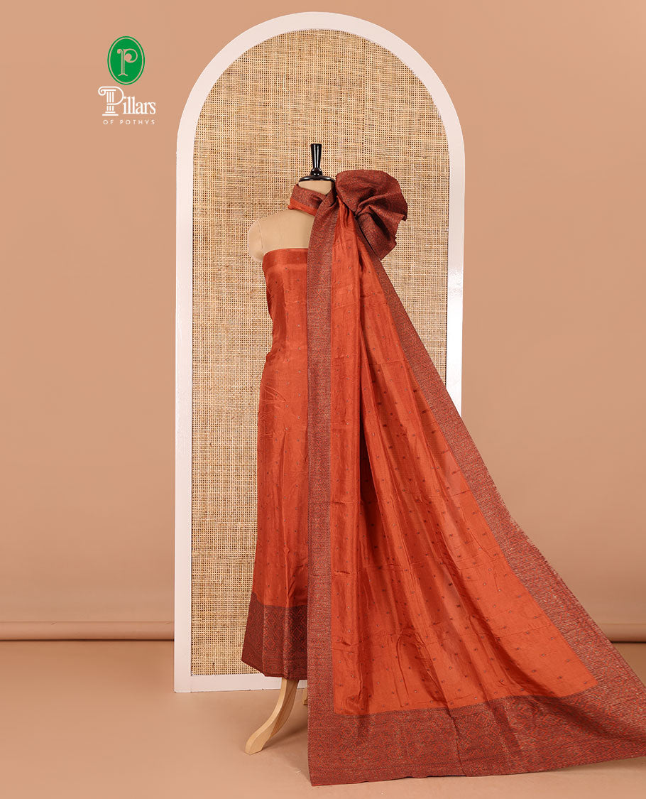 Rust material chudidar set, copper zari buttas and jaal design semi-modal silk top, plain santoon bottom, and zari design woven semi-modal silk dupatta
