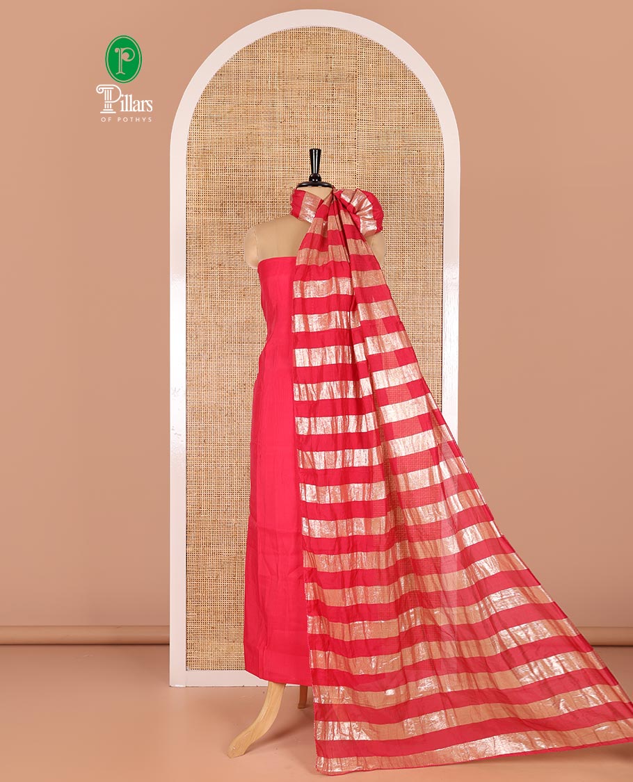 Pink material chudidar set, plain with pom-pom tasseled mul chanderi top, a matching bottom, and organza dupatta of stripes