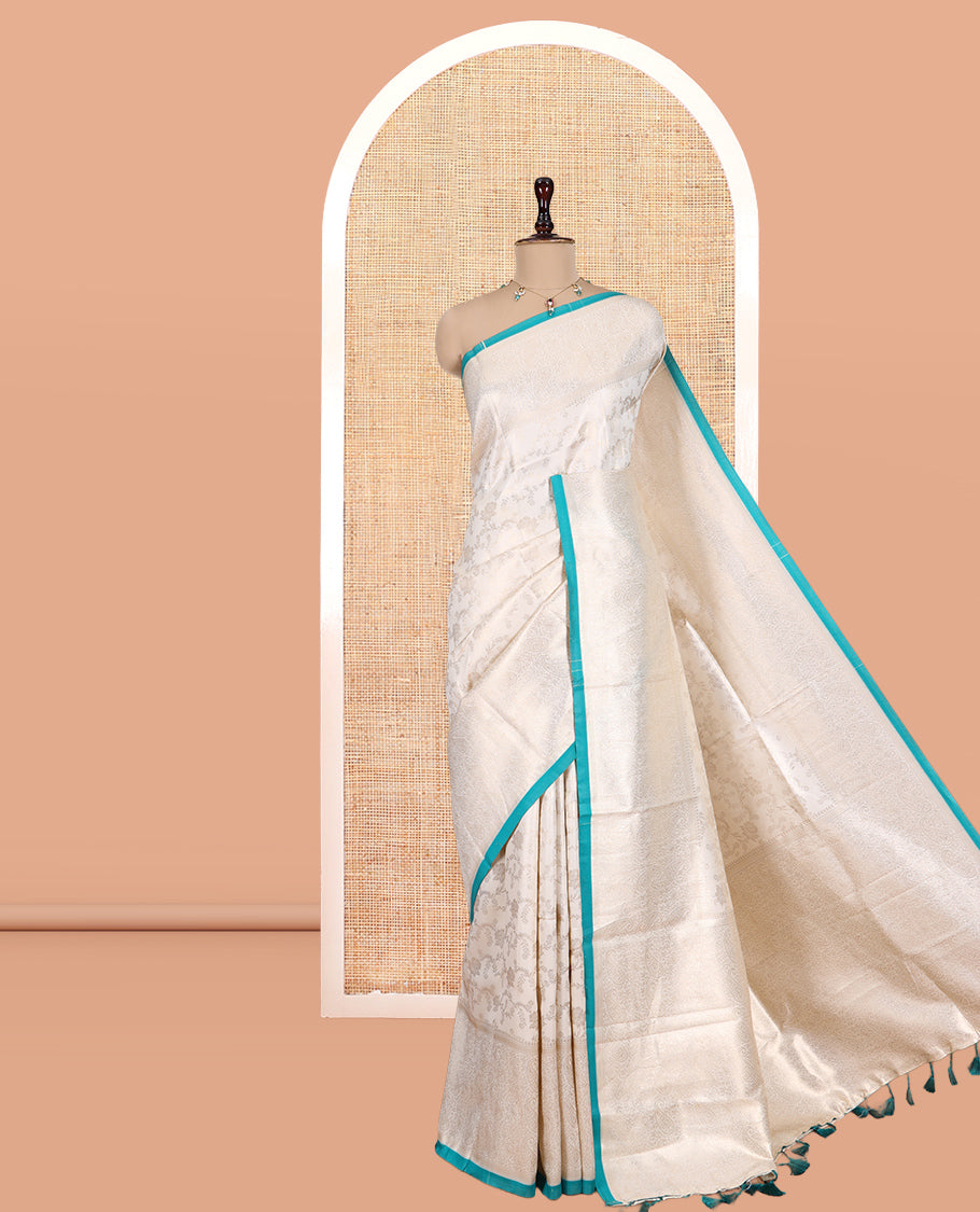 Off-White-Blue Semi-Silk Saree, Adorned with Floral Jacquard Design, a Zari Paisley Border, and a Contrast Blouse