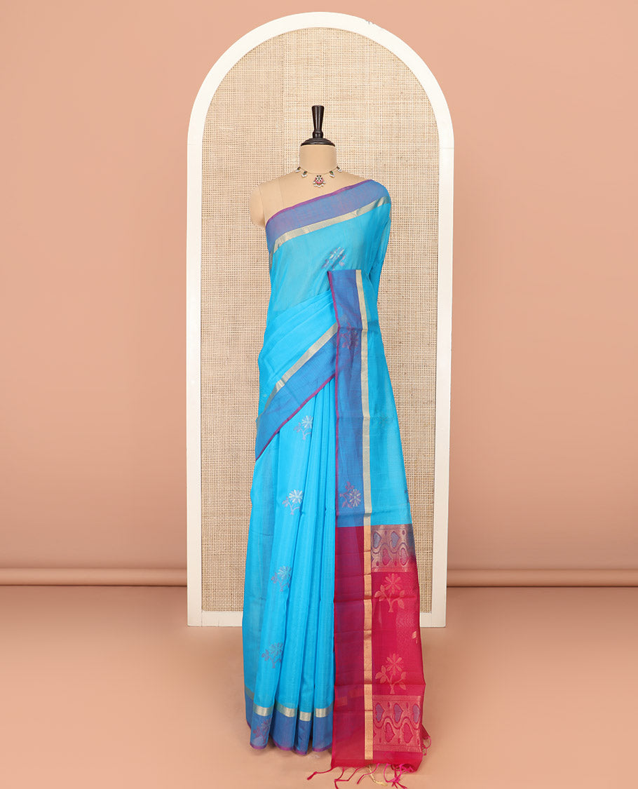 Blue Silk Cotton Saree Ornamented with Buttas All Over the Body, Complemented by a Contrast Floral Zari Motifs Border, Featuring a Contrast Pallu of Floral Zari Designs, and Paired with a Contrast Blouse