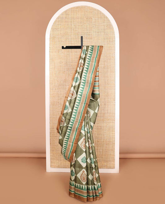 Olive green block floral print tussar saree with contrast geometric design border & floral design pallu