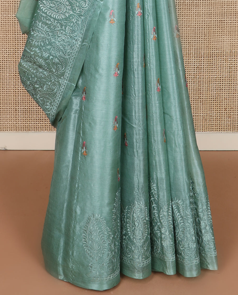Green paisley motifs, multi-color thread embroidered tussar saree, paisley thread embroidered border, and pallu