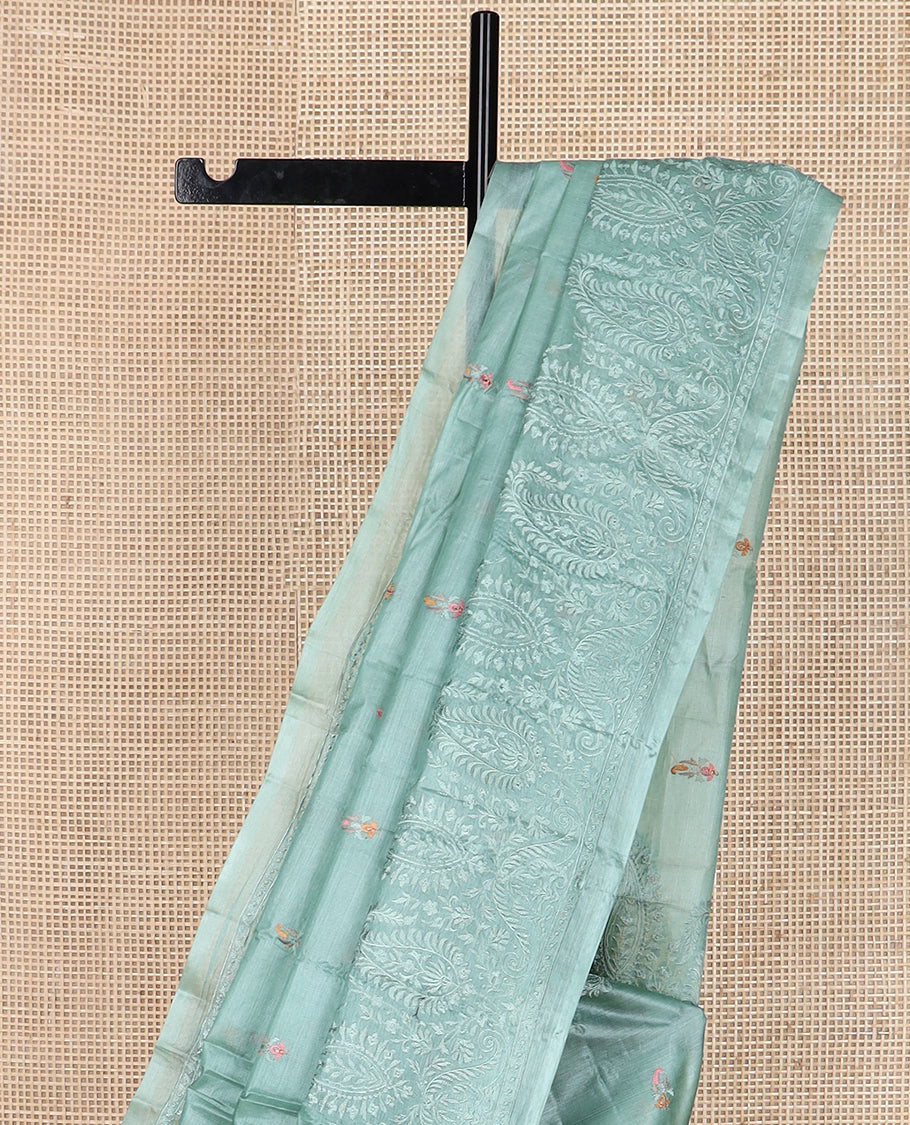Green paisley motifs, multi-color thread embroidered tussar saree, paisley thread embroidered border, and pallu