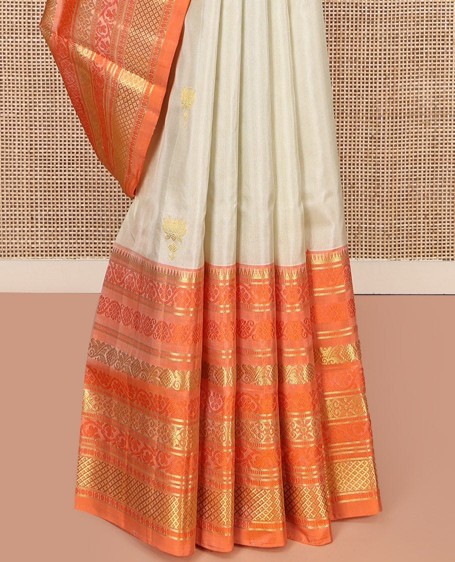 Ivory Venkatagiri Silk Saree, Enthralled with Pichwai Lotus Buttas All Over Its Body, Complemented by a Contrast Traditional Zari Design Border, Pallu of Jaal Designs, and Paired with a Contrast Blouse