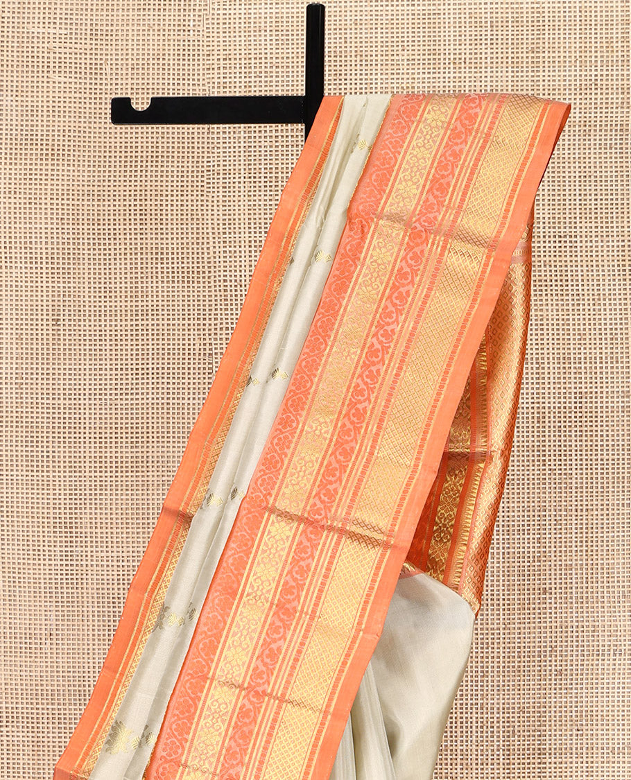 Ivory Venkatagiri Silk Saree, Enthralled with Pichwai Lotus Buttas All Over Its Body, Complemented by a Contrast Traditional Zari Design Border, Pallu of Jaal Designs, and Paired with a Contrast Blouse