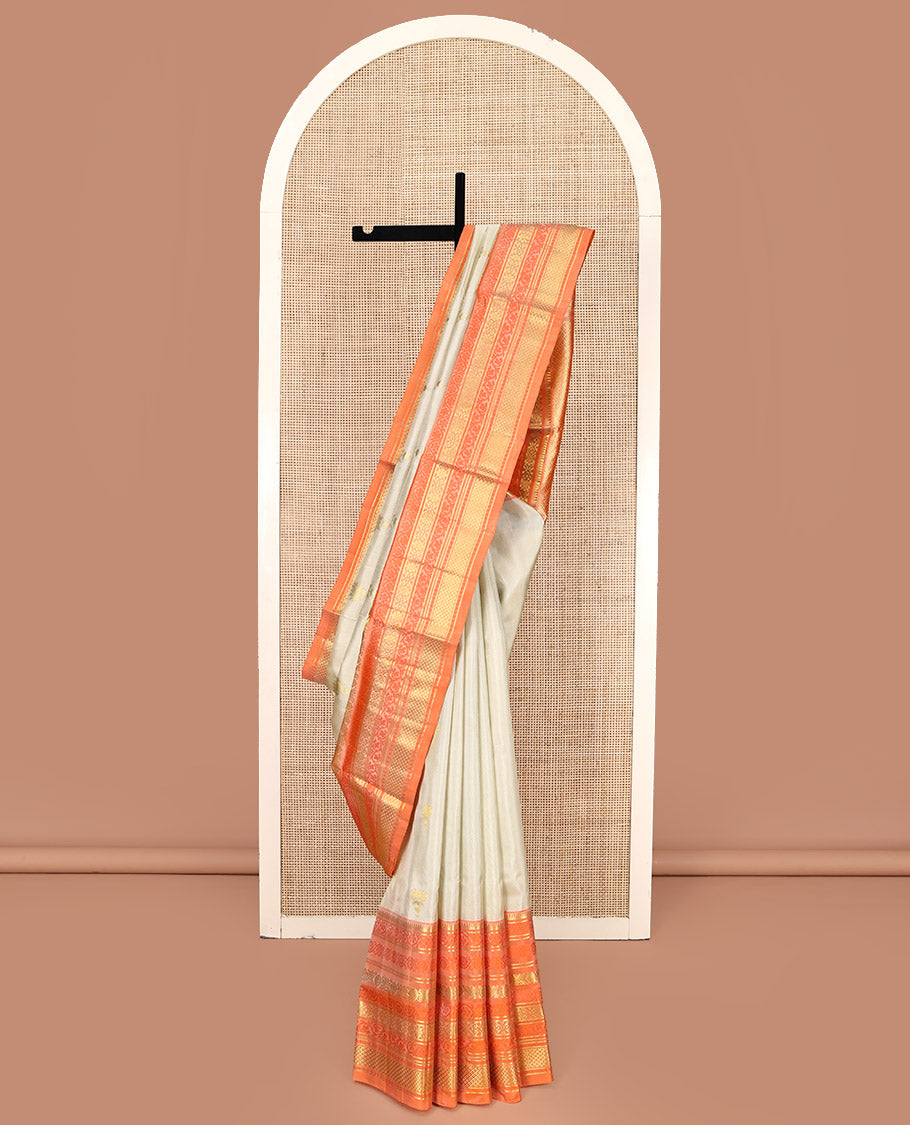 Ivory Venkatagiri Silk Saree, Enthralled with Pichwai Lotus Buttas All Over Its Body, Complemented by a Contrast Traditional Zari Design Border, Pallu of Jaal Designs, and Paired with a Contrast Blouse