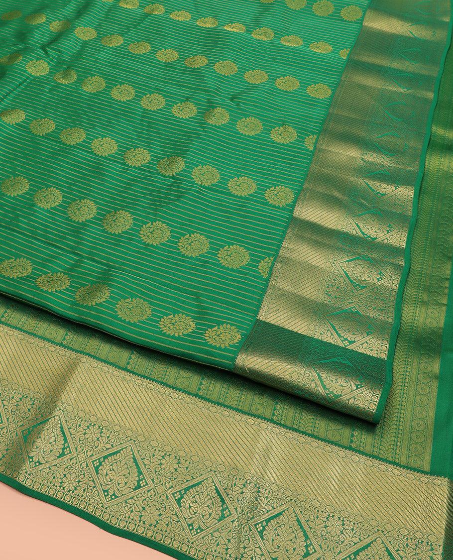 Green Vasundhara Lite Silk Mix Saree, Subtly Sparkled with Zari Buttas All Over Its Body, Complemented by Zari Border, Grand Pallu Steeped with Traditional Designs, and Paired with a Matching Blouse