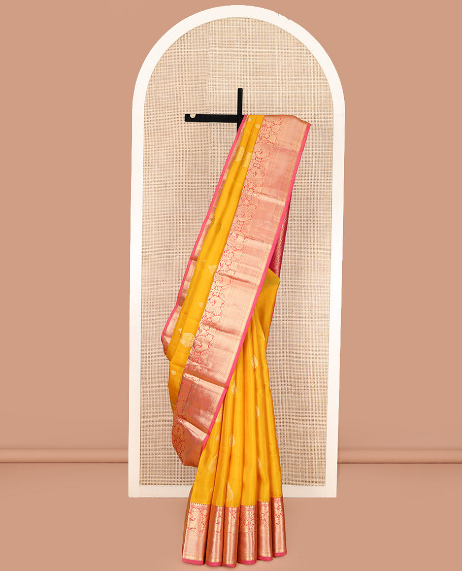 Yellow Vasundhara Lite Silk Mix Saree, Adorned with Zari Buttas All Over Its Body, Complemented by a Contrast Border of Thilakam Mokku, Muthu, Mayil, Kamalam, and Mayil Kann Designs, Gracefully Embellished Pallu, and Paired with a Contrast Blouse