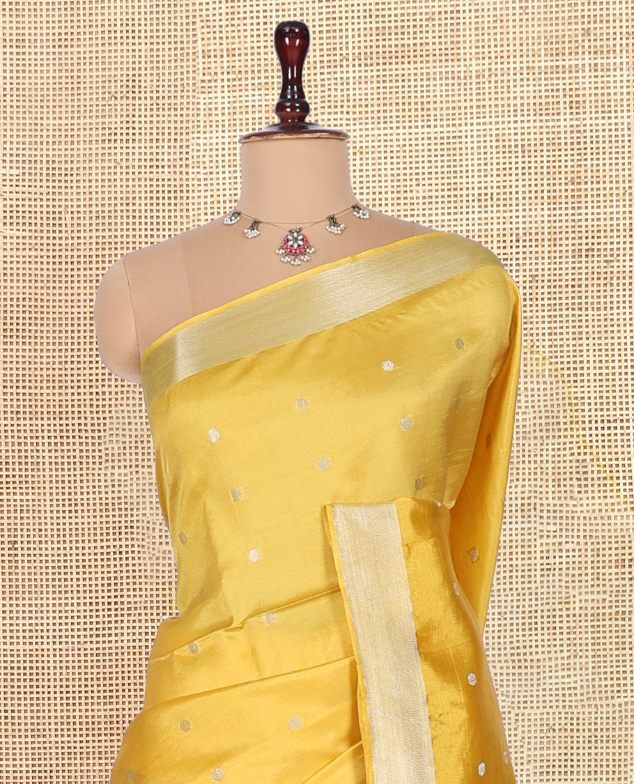 Yellow Banana Pith Saree, Adorned with Buttas, a Zari Border, Striped Pallu, and Matching Blouse