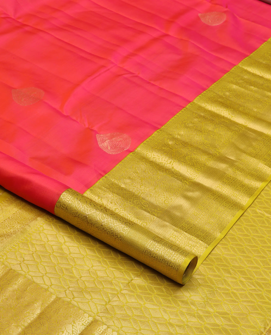 Red zari buttas silk saree, contrast border of thilakam mokku, muthu, yaali, and mayil kann, and geometric pallu