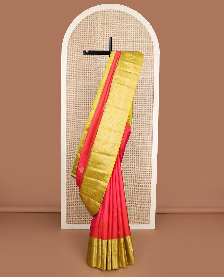 Red zari buttas silk saree, contrast border of thilakam mokku, muthu, yaali, and mayil kann, and geometric pallu