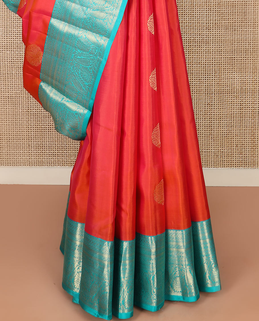 Orange Vasundhara Silk Saree Artfully Detailed with Zari Buttas, Complemented by a Contrast Border of Salngai, Neli, Kathir, and Floral-Paisley Designs, Zari-Rich Jaal Pallu, and Paired with a Contrast Zari-Bordered Blouse