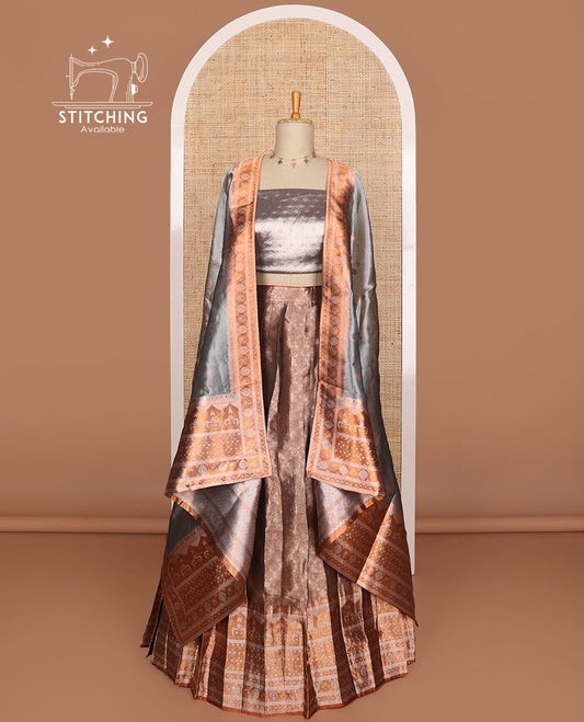 Mauve buttas tissue half saree with contrast zari design border, checked design blouse & floral design dhavani