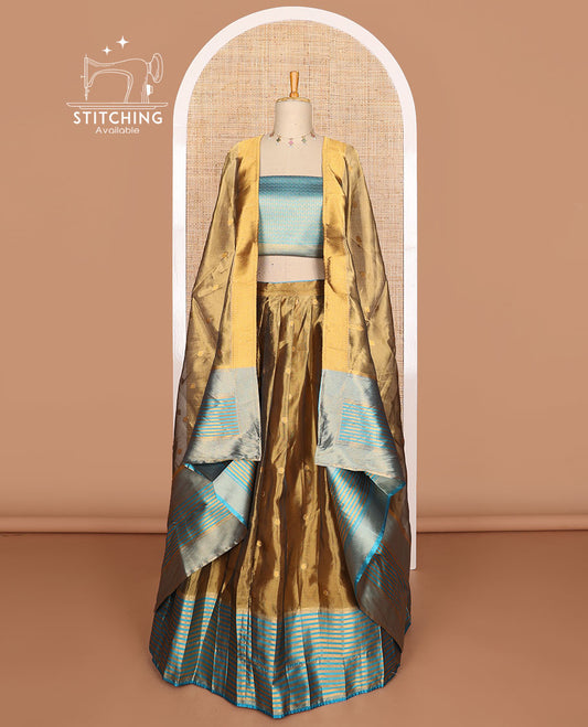 Brown buttas tissue half saree with contrast zari design border, zari design blouse & floral design dhavani