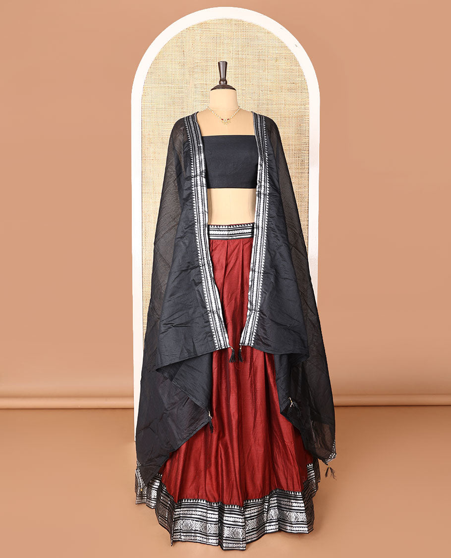 Maroon art-silk half-saree, plain with contrast temple traditional design bordered skirt, contrast blouse, and plain zari bordered dhavani