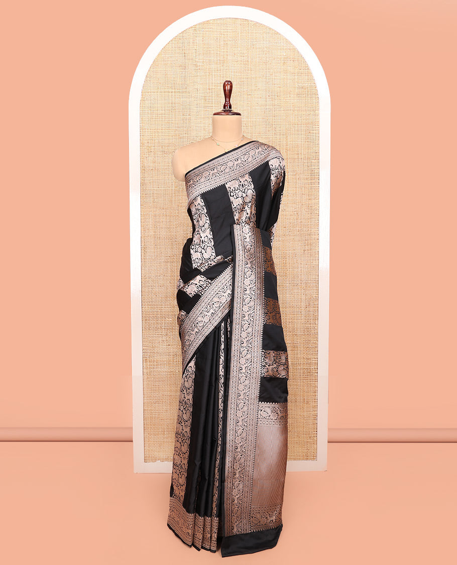 Black Semi-Banaras Silk Saree, Majestically Detailed with Animal-themed Jacquard Designs on Its Body, Highlighted by a Zari Border of Traditional Designs, Pallu Steeped with Stripes, and Paired with a Matching Blouse