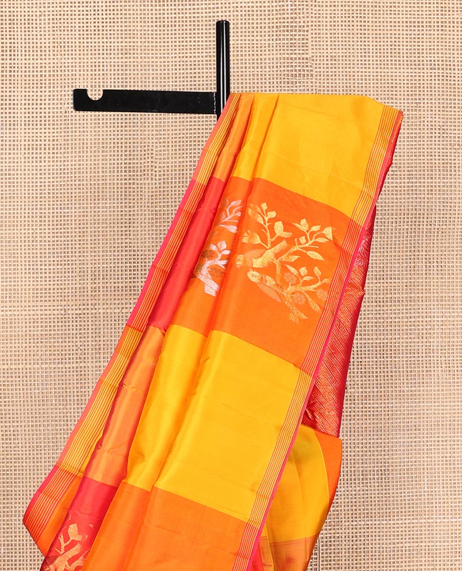 Multi-colored bird buttas enclosed macro-checked Kanchipuram silk saree, striped piping border, and zari-rich pallu