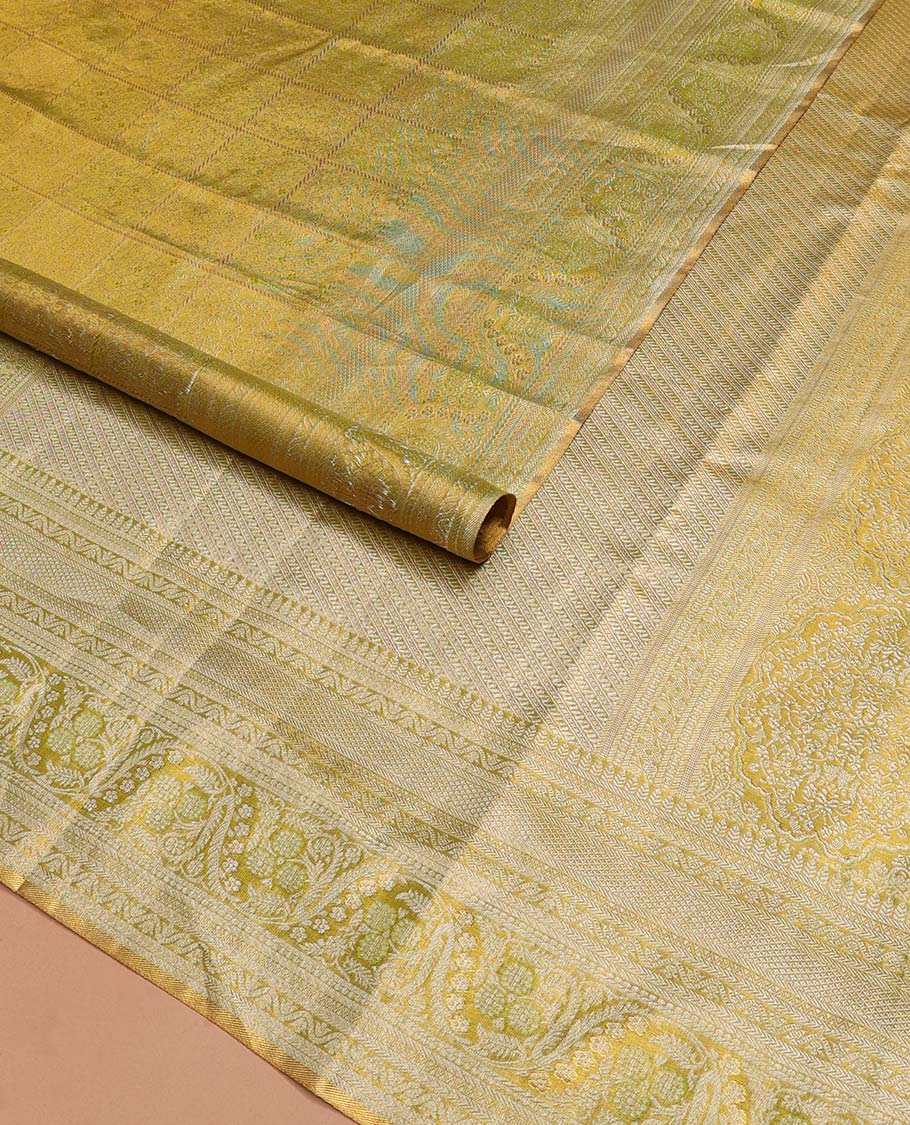 Green Kanchipuram Tissue Silk Saree, Detailed with Jacquard Design on Its Body, Highlighted by a Zari Border of Kathir, Mayil Kann, and Dhavana Kodi Designs, Gracefully Embellished Pallu, and Paired with a Matching Blouse