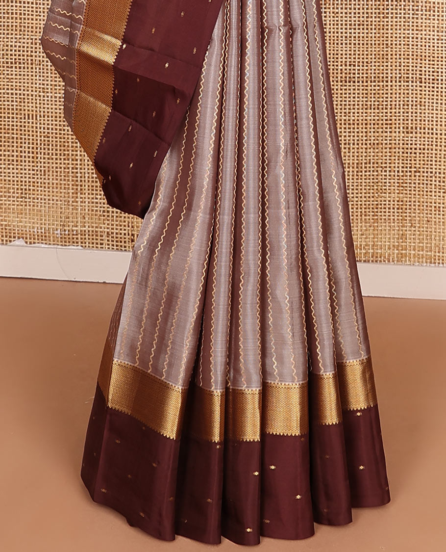 Grey Vasundhara Lite-Silk Mix Saree Enriched with Zig-Zag Zari Stripes, Complemented with a Contrast Border Featuring Rekku, Muthu, and Mayil Kann Design, Opulently Embellished Pallu of Jaal Design, and a Contrast Blouse