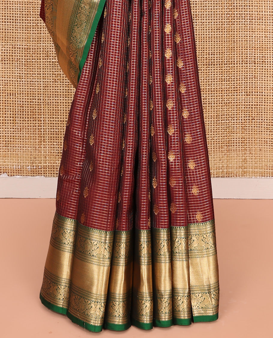 Brown Vasundhara Lite Silk Mix Saree, Meticulously Crafted with Zari Buttas and Checks On Its Body, Complemented by Contrast Border of Thilakam Mokku, Muthu, Banaras, Mayil, and Mayil Kann Designs, Grandly Decked Up Pallu and Paired with a Contrast Blouse