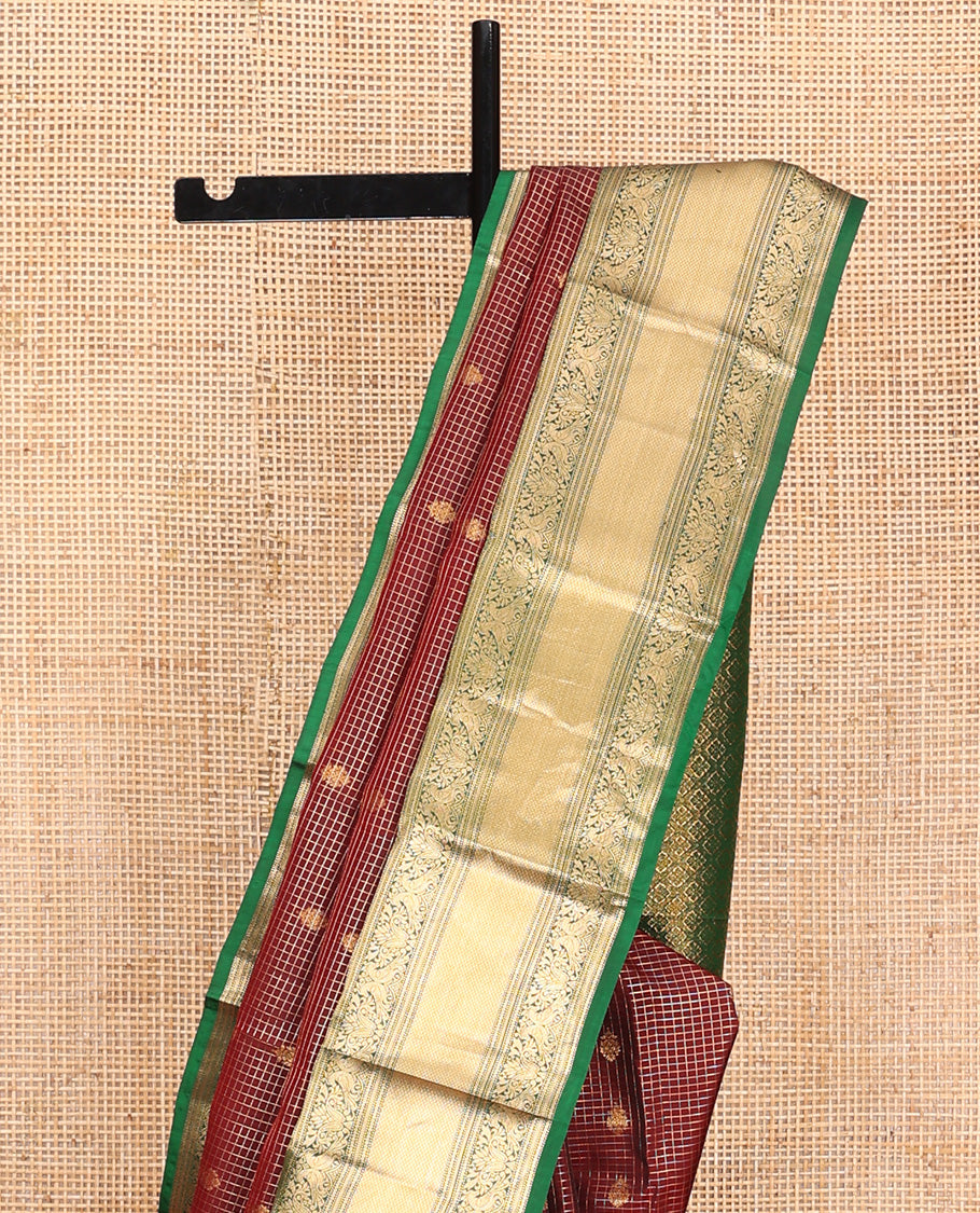 Brown Vasundhara Lite Silk Mix Saree, Meticulously Crafted with Zari Buttas and Checks On Its Body, Complemented by Contrast Border of Thilakam Mokku, Muthu, Banaras, Mayil, and Mayil Kann Designs, Grandly Decked Up Pallu and Paired with a Contrast Blouse