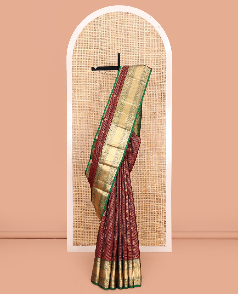 Brown Vasundhara Lite Silk Mix Saree, Meticulously Crafted with Zari Buttas and Checks On Its Body, Complemented by Contrast Border of Thilakam Mokku, Muthu, Banaras, Mayil, and Mayil Kann Designs, Grandly Decked Up Pallu and Paired with a Contrast Blouse