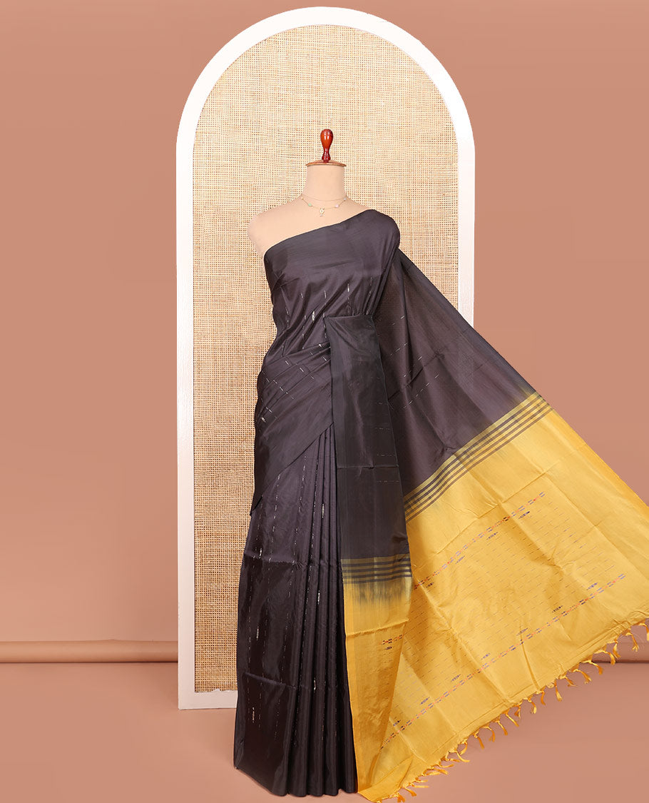 Borderless Black Banana Pith Saree Enriched with Zari Buttas, Complemented by a Contrasting Pallu of Buttas and Stripes, and Paired with a Contrast Plain Blouse