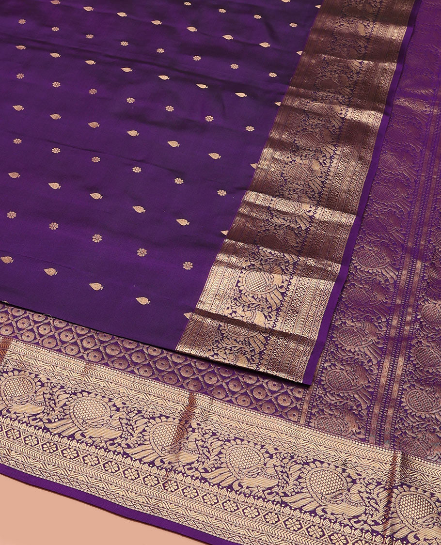 Violet Vasundhara Silk Saree Graced with Zari Buttas All Over Its Body, Highlighted by a Zari Border of Kathir, Mayil, Kann, Thilakam, Mayil, and Kamalam Designs, Grand Pallu of Geometric Patterns, and Paired with a Matching Blouse