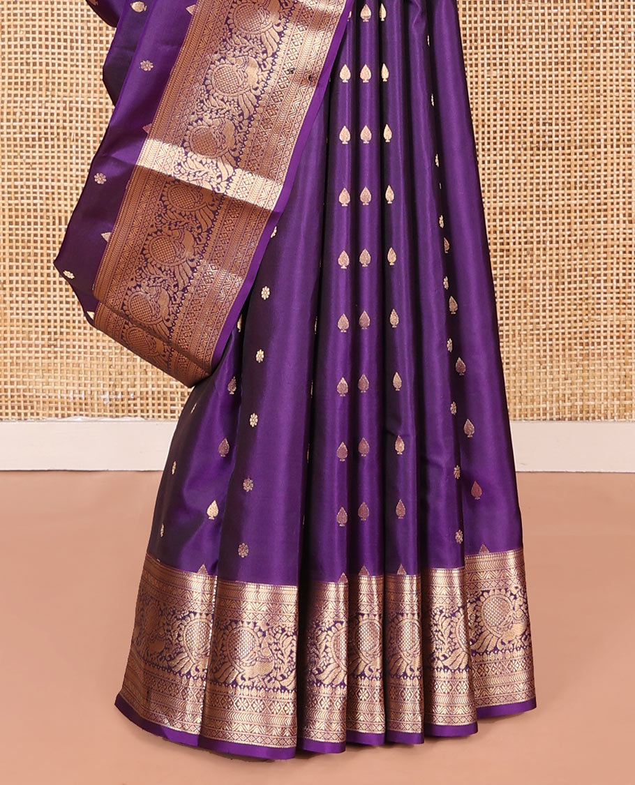 Violet Vasundhara Silk Saree Graced with Zari Buttas All Over Its Body, Highlighted by a Zari Border of Kathir, Mayil, Kann, Thilakam, Mayil, and Kamalam Designs, Grand Pallu of Geometric Patterns, and Paired with a Matching Blouse