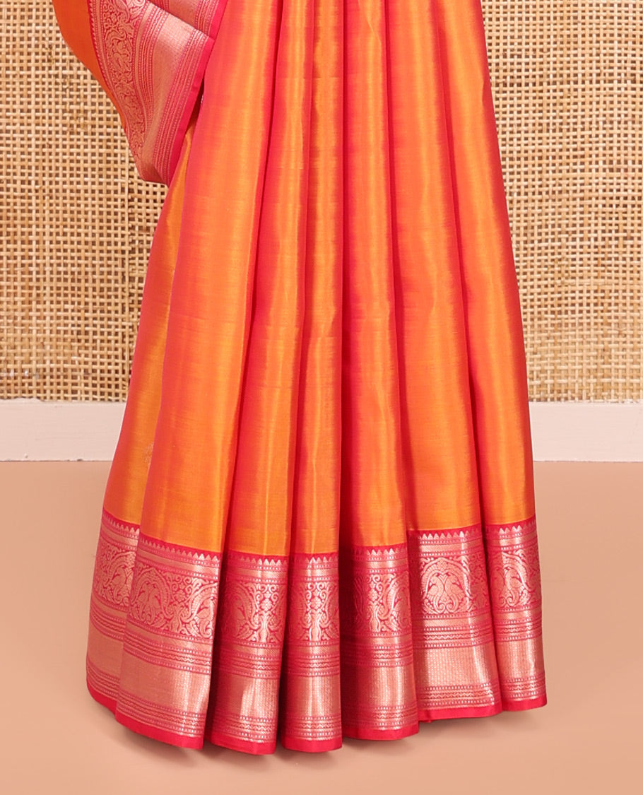Orange Vasundhara Silk Saree, Sparsely Sparkled with Zari Buttas All Over Its Body, Complemented by a Contrast Border of Rekku, Muthu, Kili, Banaras, Neli, and Mayil Kann Designs, Grand Pallu, and Paired with a Contrast Blouse