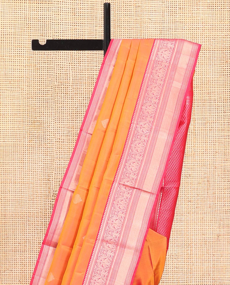 Orange Vasundhara Silk Saree, Sparsely Sparkled with Zari Buttas All Over Its Body, Complemented by a Contrast Border of Rekku, Muthu, Kili, Banaras, Neli, and Mayil Kann Designs, Grand Pallu, and Paired with a Contrast Blouse