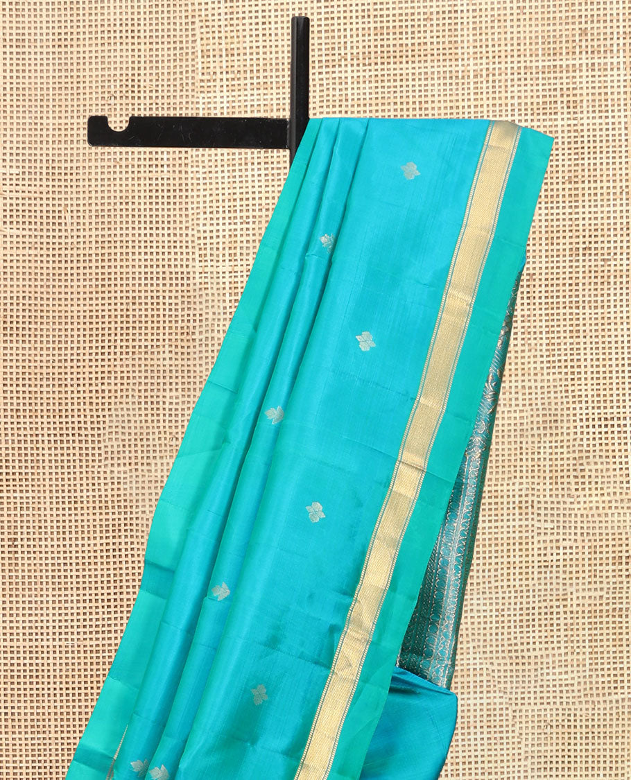 Blue Vasundhara Silk Saree, Subtly Sparkled with Zari Buttas, a Kal Eragina Border of Muthu Designs, Geometric Patterned Pallu, and a Matching Blouse