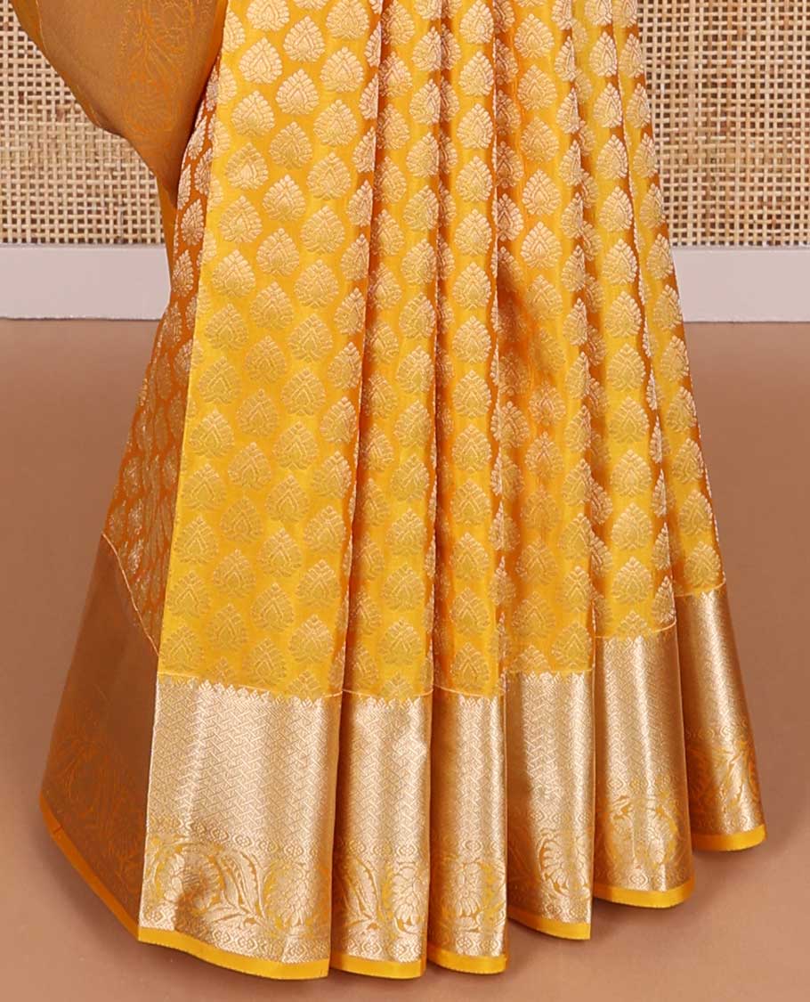 Yellow buttas kancheepuram silk saree with self border of intricate zari design border & floral design pallu