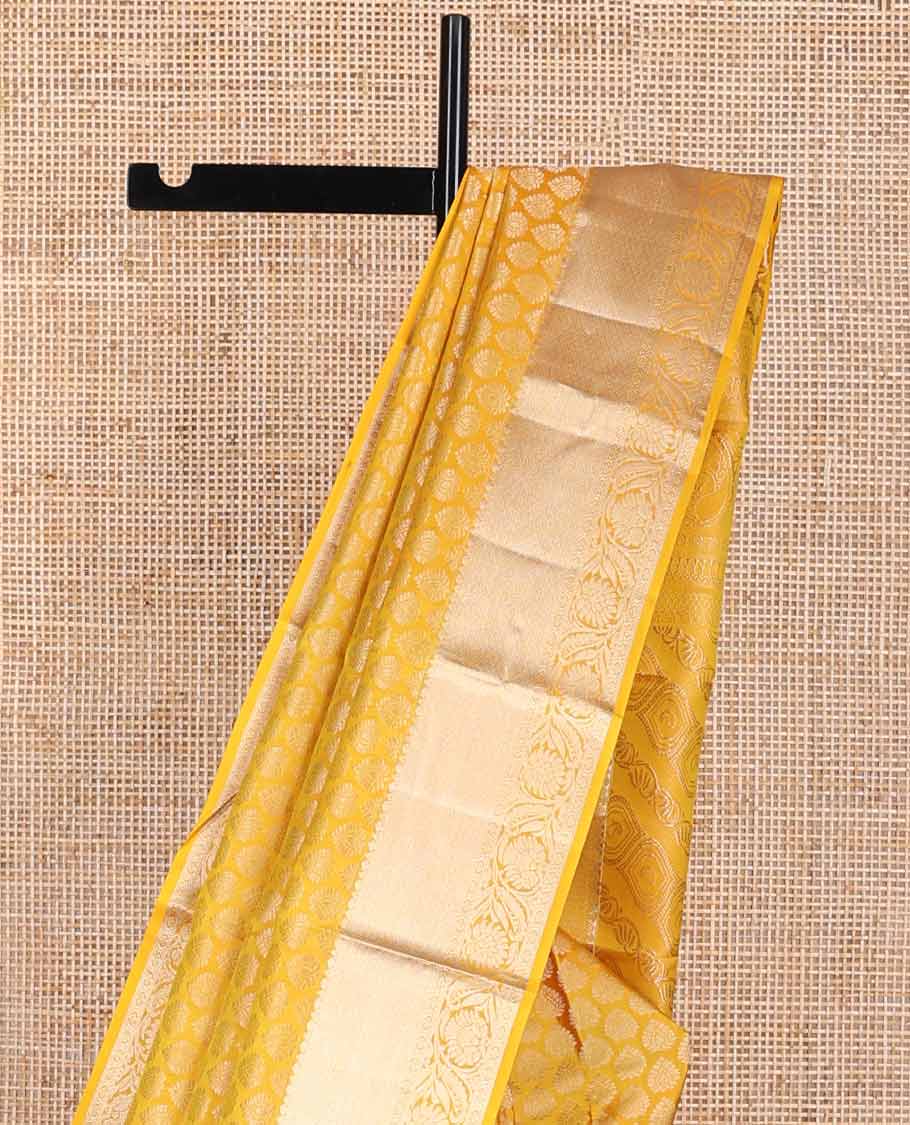 Yellow buttas kancheepuram silk saree with self border of intricate zari design border & floral design pallu