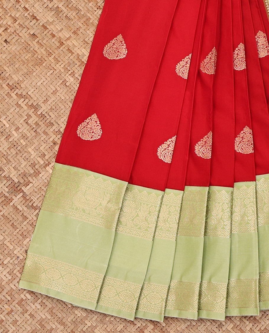 Red Budget Silk Saree, Richly Detailed with Zari Buttas All Over Its Body, Complemented by a Contrast Traditional Zari Design Rettai Pettu Border, Gleaming Zari-Woven Jaal Pallu, and Paired with a Contrast Blouse