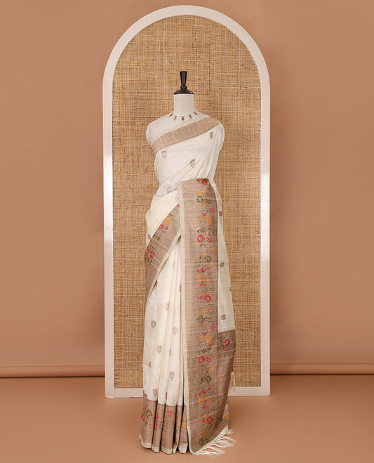 White floral zari buttas jute silk saree, contrast meenakari floral creeper & jaal design border, jaal pallu & matching plain blouse