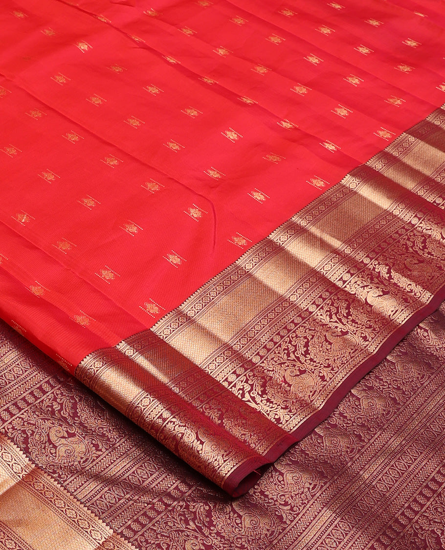 Red zari buttas Vasundhara silk mix saree, contrast border of rekku, laddu kamalam, kuyil kann, rettai neli, poun, and mayil, and intricate pallu