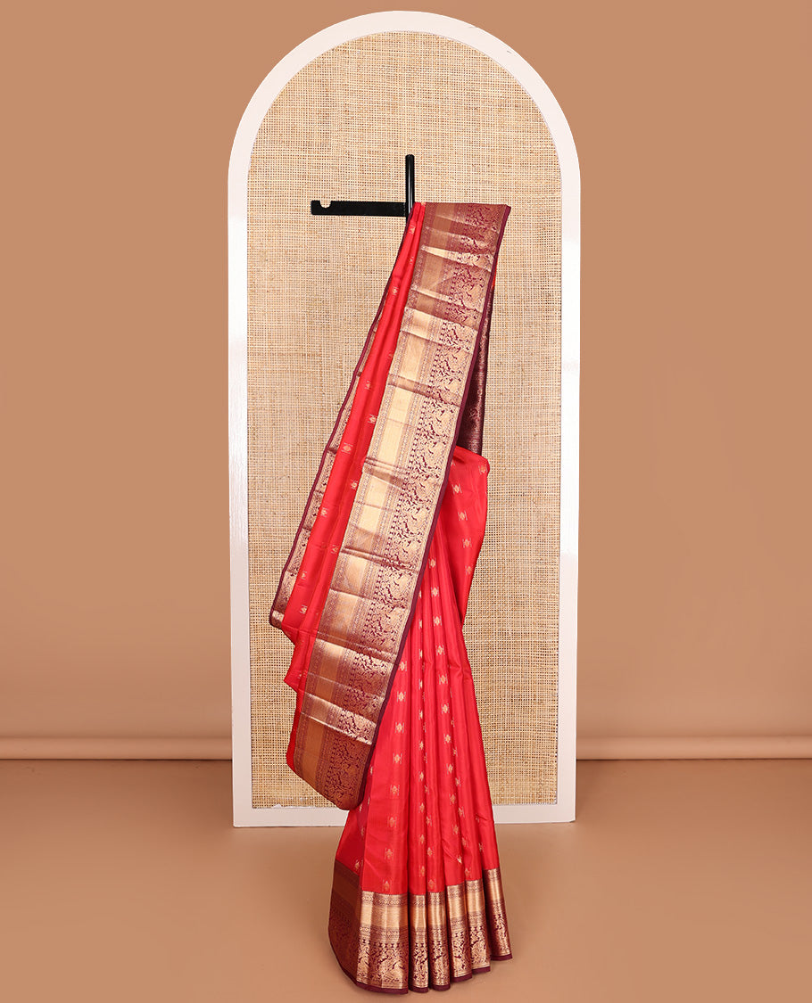 Red zari buttas Vasundhara silk mix saree, contrast border of rekku, laddu kamalam, kuyil kann, rettai neli, poun, and mayil, and intricate pallu