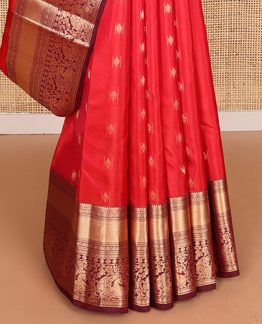 Red zari buttas Vasundhara silk mix saree, contrast border of rekku, laddu kamalam, kuyil kann, rettai neli, poun, and mayil, and intricate pallu