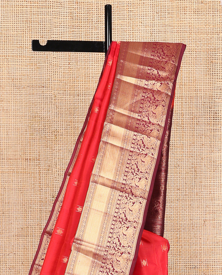 Red zari buttas Vasundhara silk mix saree, contrast border of rekku, laddu kamalam, kuyil kann, rettai neli, poun, and mayil, and intricate pallu