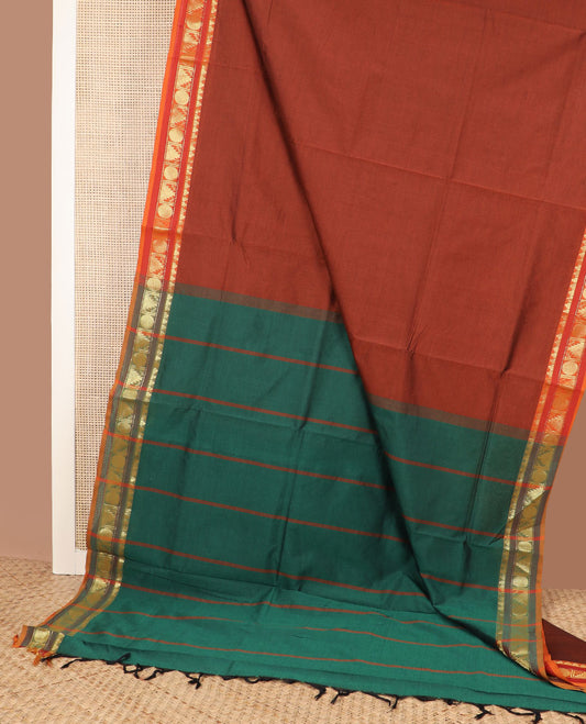 Dark orange plain design poly cotton saree, contrast traditional zari border & contrast striped pallu