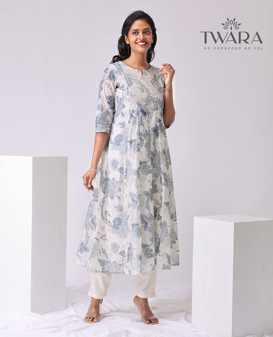 Twara cream floral print , embroidered round neck, 3/4 th sleeve , below knee lenght a-line kurti