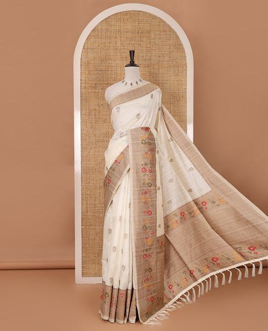 White floral zari buttas jute silk saree, contrast meenakari floral creeper & jaal design border, jaal pallu & matching plain blouse