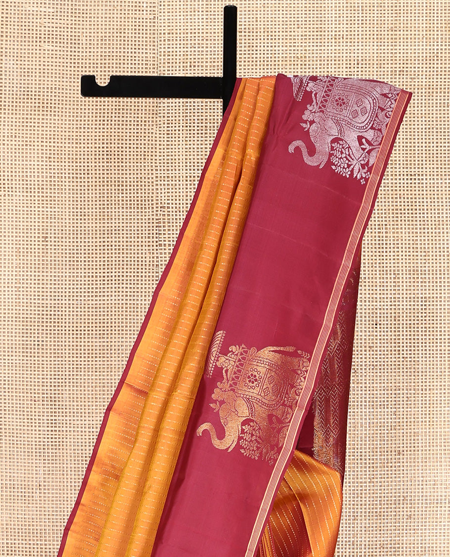 Orange Mayuri Lite Silk Mix Saree, Beautified with Muthu Stripes All Over Its Body, Complemented by a Contrast Border of Yaanai Designs, Pallu of Intricate Designs, and Paired with a Contrast Blouse