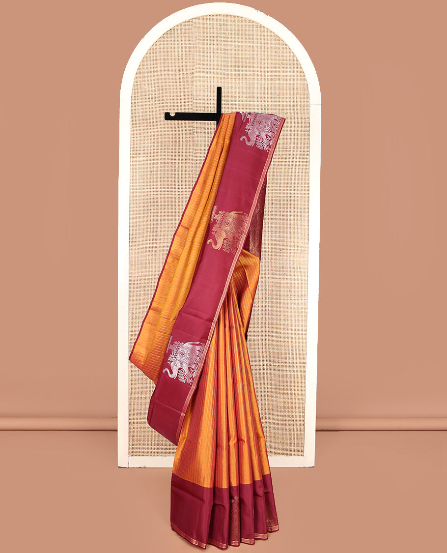 Orange Mayuri Lite Silk Mix Saree, Beautified with Muthu Stripes All Over Its Body, Complemented by a Contrast Border of Yaanai Designs, Pallu of Intricate Designs, and Paired with a Contrast Blouse