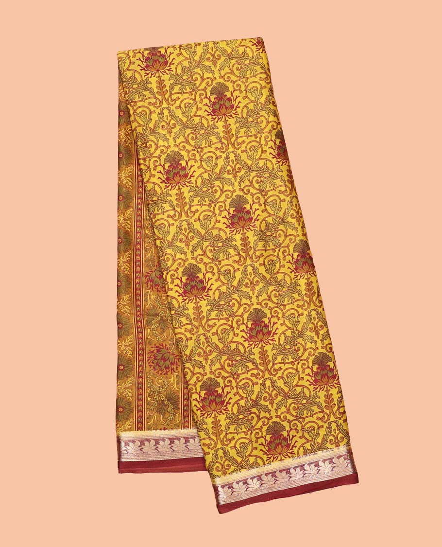 Yellow intricately printed semi-banaras printed saree, contrast floral border & intricate pallu