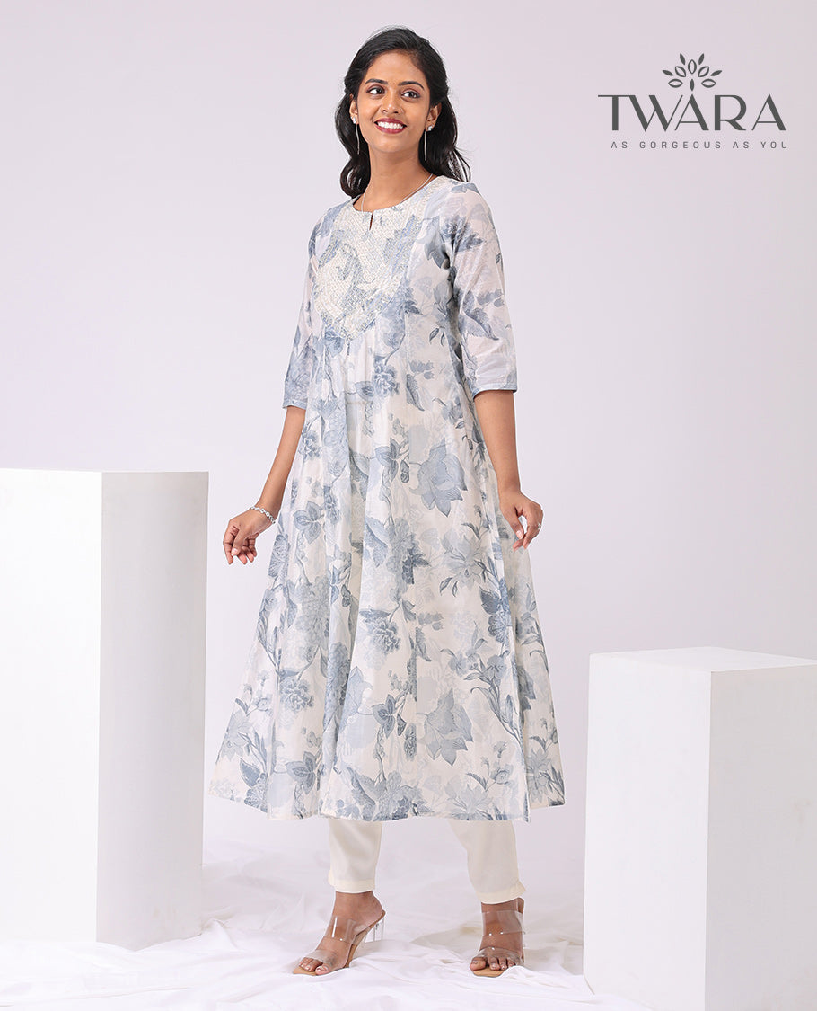 Twara cream floral print , embroidered round neck, 3/4 th sleeve , below knee lenght a-line kurti